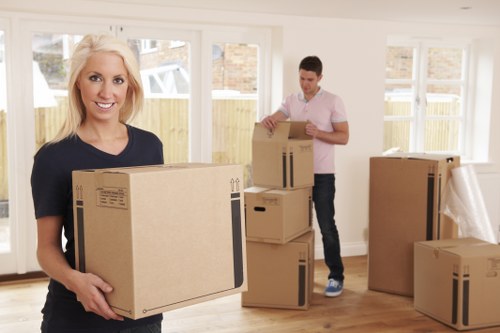 Professional movers handling office furniture in Crystalpalace