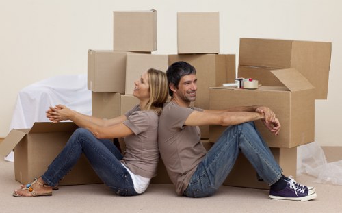 Mover wearing PPE while handling boxes