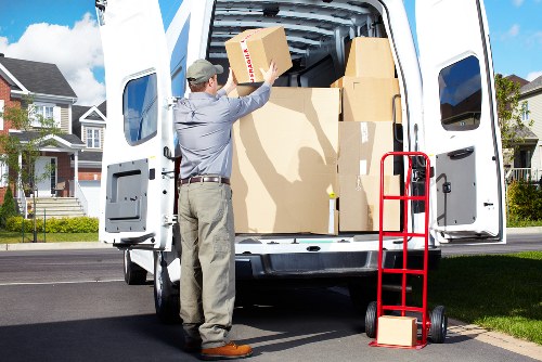A moving team loading furniture for home moves in Crystalpalace