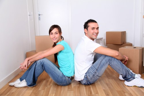 Professional movers handling furniture in a Crystal Palace property