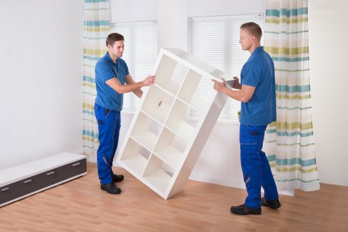 Professional movers loading furniture for a Crystal Palace same day move
