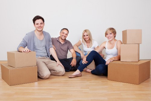Student house move with furniture carried through a residential street