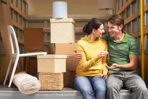 Professional team handling bulky furniture removals on a local Crystal Palace street